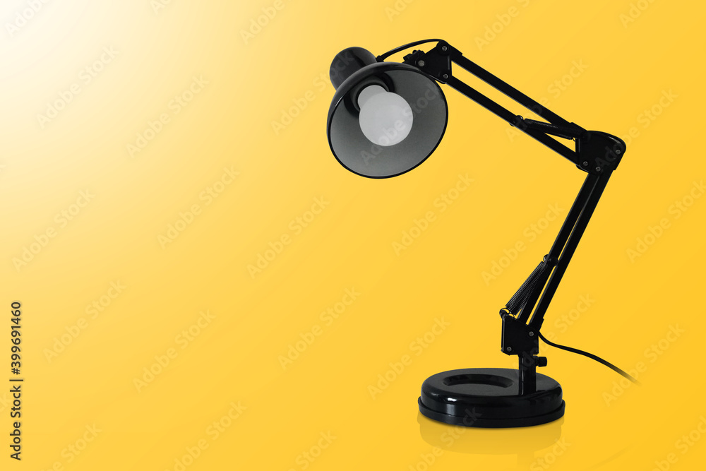 beautiful black lamp steel on yellow background, technology, object, copy space beautiful black lamp steel on yellow background, technology, object, copy space