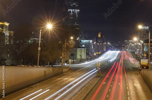 Moscow, Russia, Dec 10,2020: Zemlyanoy val street (part of the Gardern Ring) and Krasnoholmsky bridge. Evening, Car traces, Long exposure