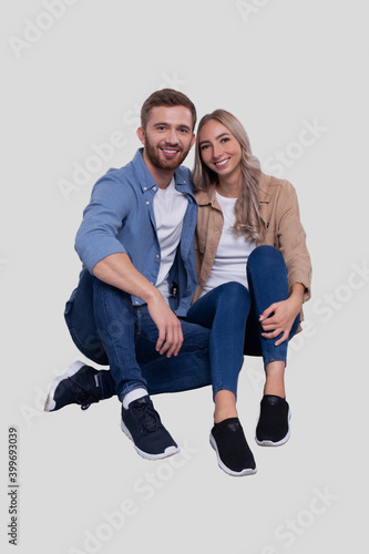 Couple Sitting on Floor Hugging. Couple Isolated Watching Front. Relationship, Family, Lovers, Friends Concept