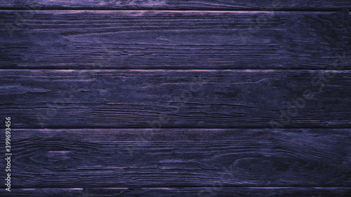 Wooden parquet texture. Neon lighting. Background surface
