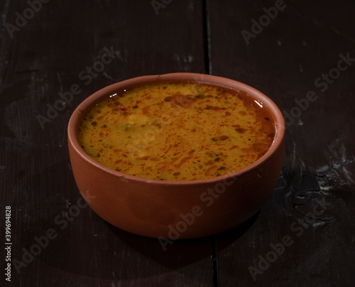 Indian Famous Cuisine Dal Tadka on Vintage Wooden Background photo