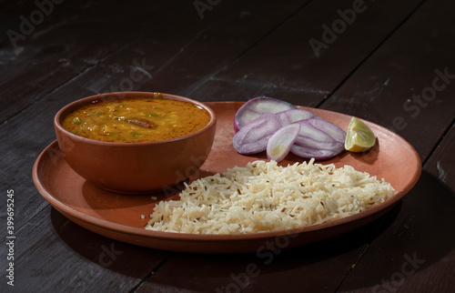 Indian Cuisine Jeera Rice With Dal Tadka Also Know As Cumin Rice on Vintage Wooden Background photo