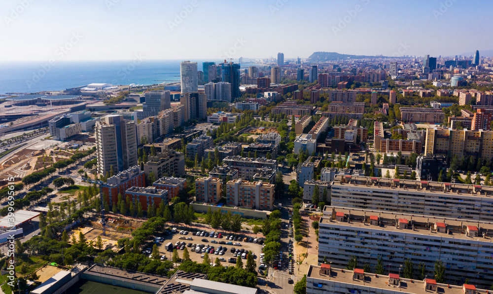 Fototapeta premium Aerial view of modern buildings in coastal areas of Diagonal mar in Barcelona, Spain