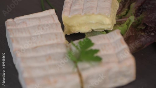 Pont l'Eveque, French Cheese from Normandy produced from Cow's Milk on turntable photo