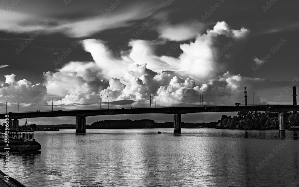 Summer black and white landscape with clouds over the river in the city of Kostroma, Russia.