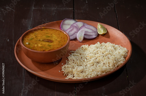 Indian Cuisine Jeera Rice With Dal Tadka Also Know As Cumin Rice on Vintage Wooden Background photo