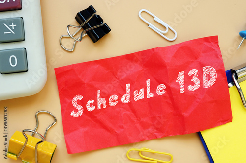 Business concept about Schedule 13D with phrase on the piece of paper. photo