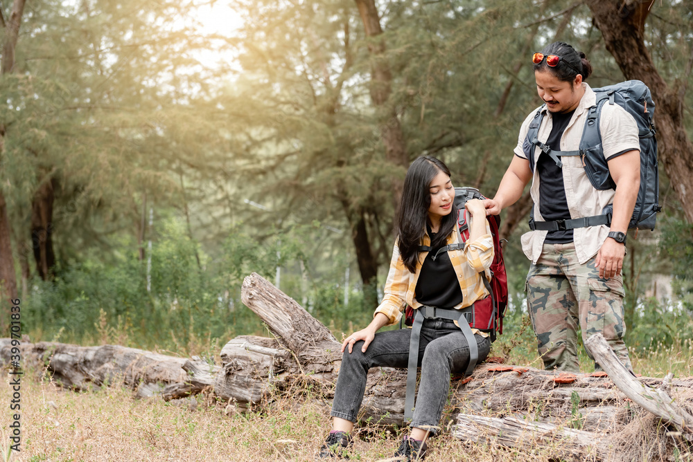 Asian backpacker men and women are showing compassion for each other on hiking, camping. Asian backpacker men and women are showing compassion for each other on hiking, camping.