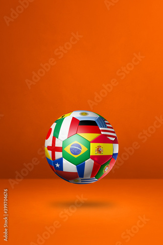 Football soccer ball with national flags on a orange studio background