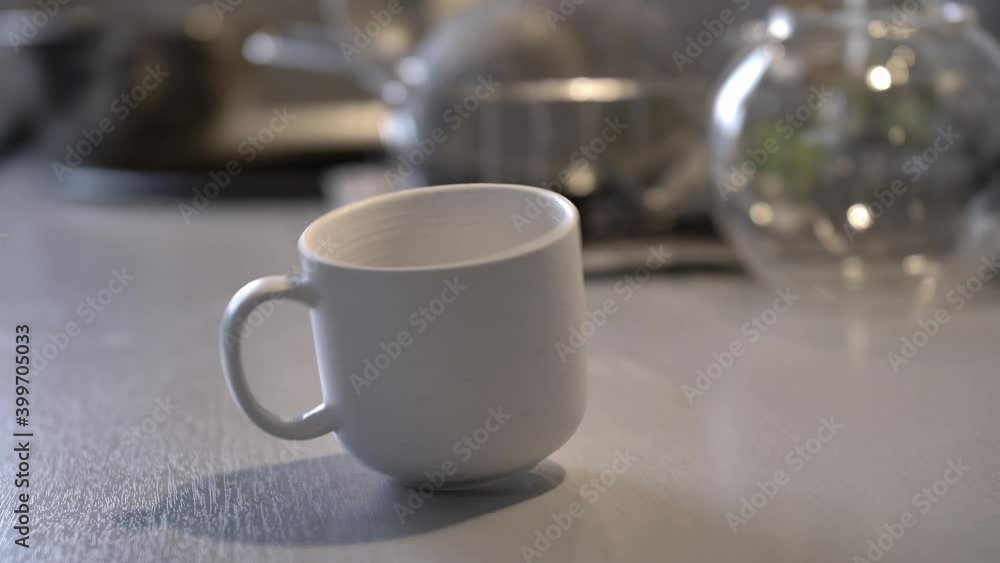 Coffee Cup Spinning Around on Kitchen Table Coffee Cup Spinning Around on Kitchen Table