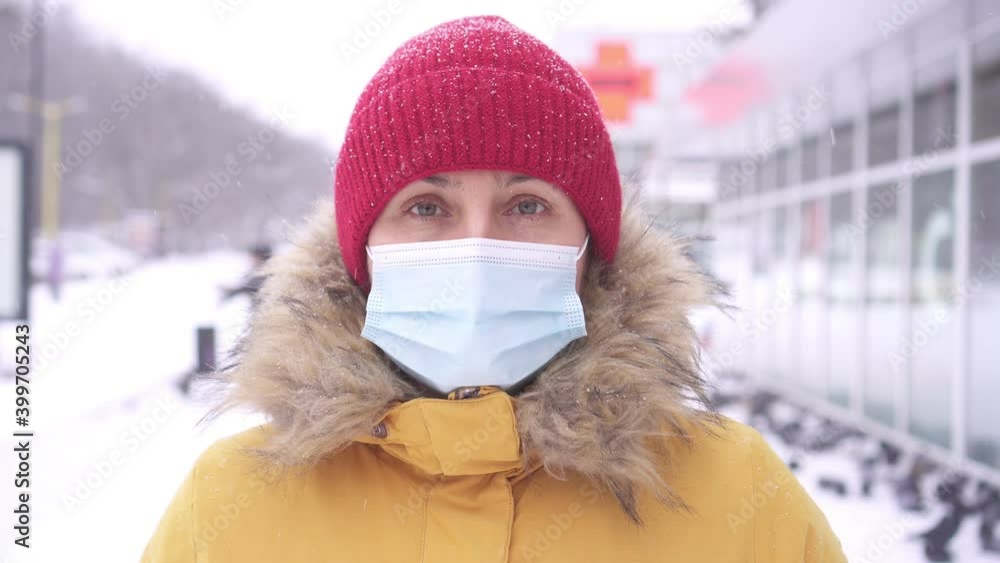 Pandemic, portrait of a young woman wearing protective mask on street. covid concept health and safety, N1H1 coronavirus quarantine, second wave covid virus protection Pandemic, portrait of a young woman wearing protective mask on street. covid concept health and safety, N1H1 coronavirus quarantine, second wave covid virus protection