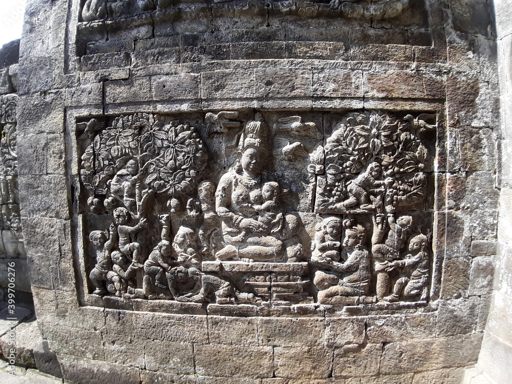 Stone carving on the wall of Mendut Temple, Central Java, Indonesia