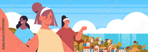 mix race girls taking selfie on smartphone camera happy women making self photo summer vacation concept seascape background horizontal portrait vector illustration