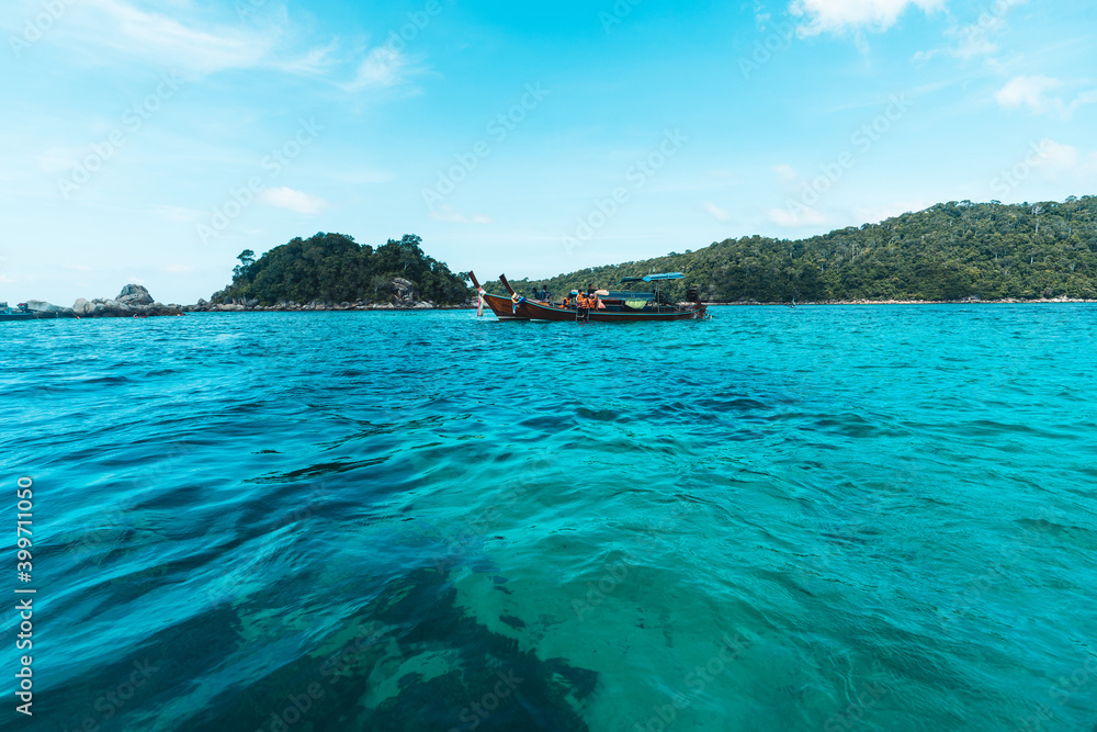 Long-tailed boat prow in the blue sea and clear sky. Long-tailed boat prow in the blue sea and clear sky.