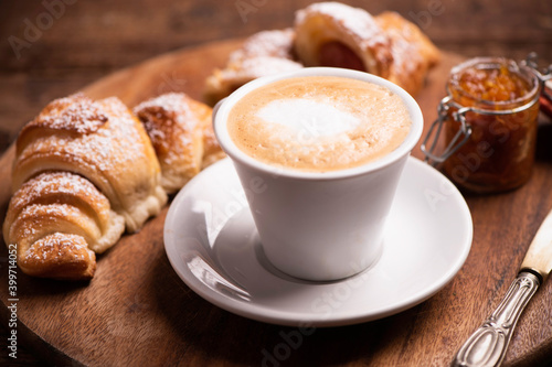 Morning breakfast with cappuccino and croissants