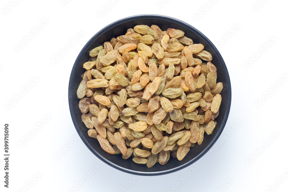 Raisins in a black bowl isolated on white background. Top view. Raisins in a black bowl isolated on white background. Top view.