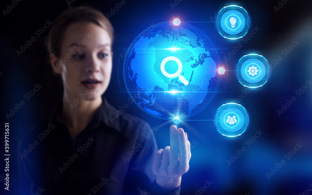 Business, Technology, Internet and network concept. Young businessman working on a virtual screen of the future and sees the inscription: Business, Technology, Internet and network concept. Young businessman working on a virtual screen of the future and sees the inscription: