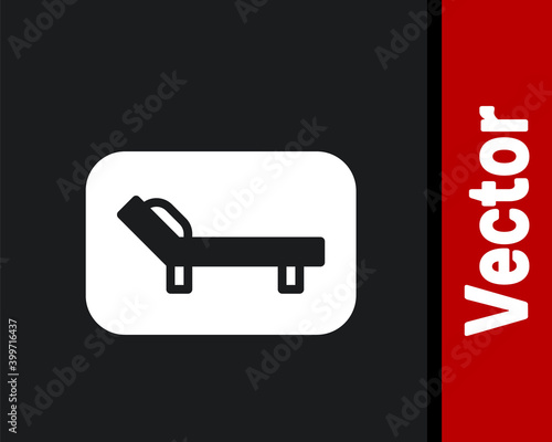 White Sunbed icon isolated on black background. Sun lounger. Vector.