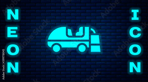 Glowing neon Ice resurfacer icon isolated on brick wall background. Ice resurfacing machine on rink. Cleaner for ice rink and stadium. Vector.
