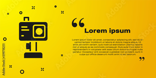 Black Action extreme camera icon isolated on yellow background. Video camera equipment for filming extreme sports. Vector.