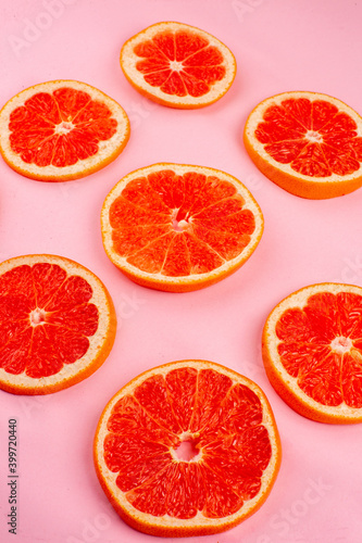 front view tasty grapefruits sliced juicy fruits on pink background healthy life juice fresh color diet