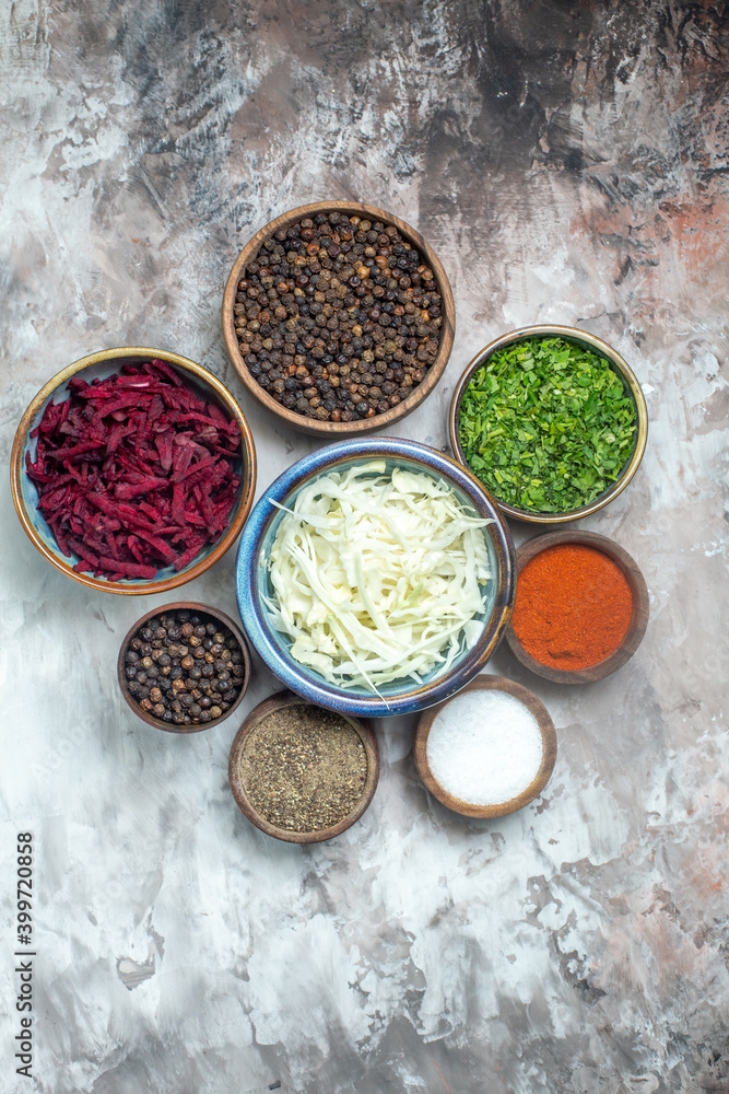 top view different seasonings with sliced cabbage greens and beet on white background photo pepper food