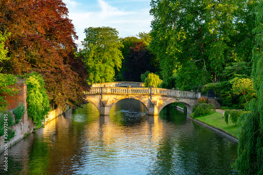 Traditional old stone bridge in Cambridge city in England viewed at golden hour