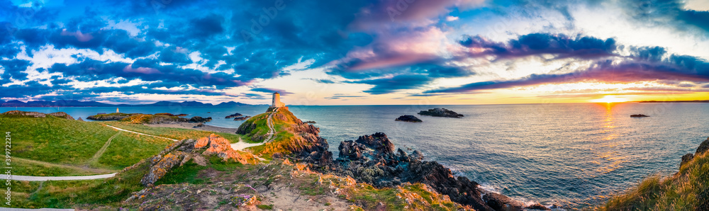 Sunset panorama of Lighthouse on Llanddwyn Island at the coast of Anglesey in North Wales,UK