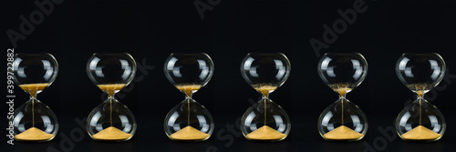 Many hourglasses with golden sand and black backgrounds show how time is running