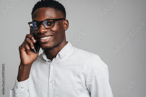 Handsome smiling young african busines man