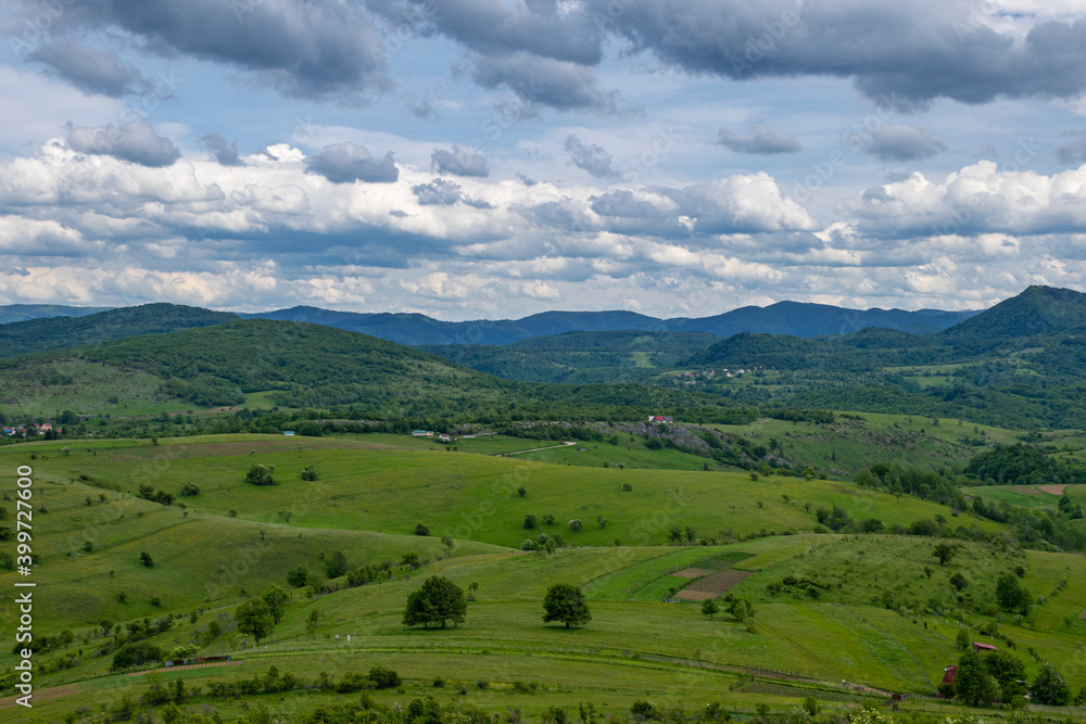Mountain landscape against cloudy sky