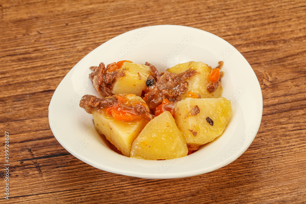 Roasted potato and beef with sauce Roasted potato and beef with sauce