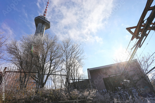 The remains of the Knyazhevski lift and the telecommunication tower Kopitoto in Vitosha Mountain above Sofia, Bulgaria on Nov 22, 2020. It was built in 1962 and is the first gondola lift in Bulgaria. photo