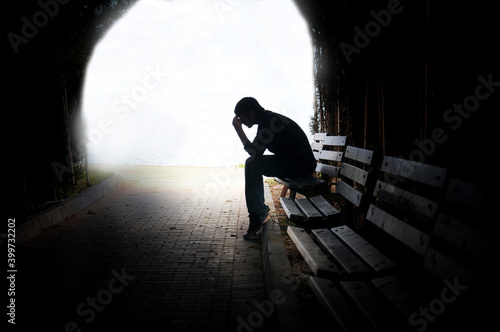 dramatic concept, Silhouette of Sad Depressed man sitting