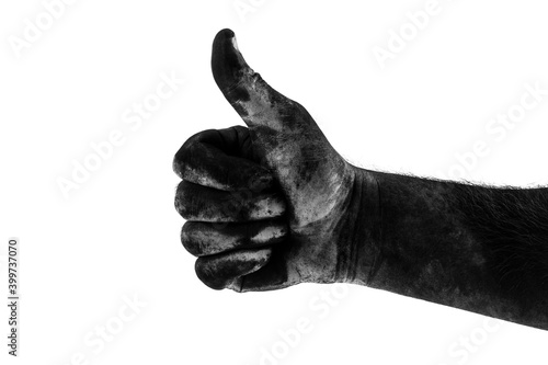 male dirty black hand showing class isolated on white background, black and white photography photo