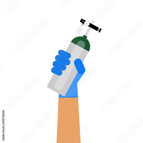 The oxygen tank held by hand of healthcare provider.
