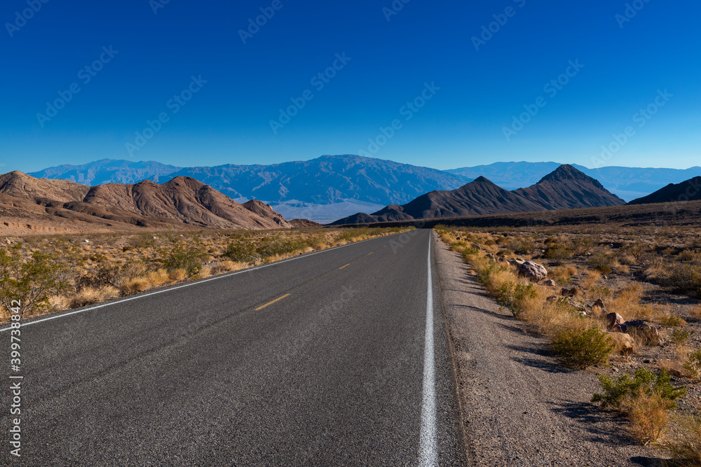 View of an empty road leading to the Death Valley, in California, USA.