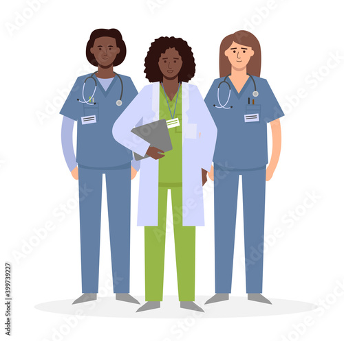 A group of nurses. Medical staff. Women in white lab coats and surgeon's pajamas smile.