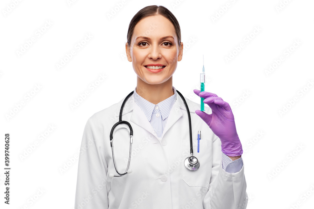medicine, vaccination and healthcare concept - happy smiling female doctor with stethoscope and syringe over white background medicine, vaccination and healthcare concept - happy smiling female doctor with stethoscope and syringe over white background