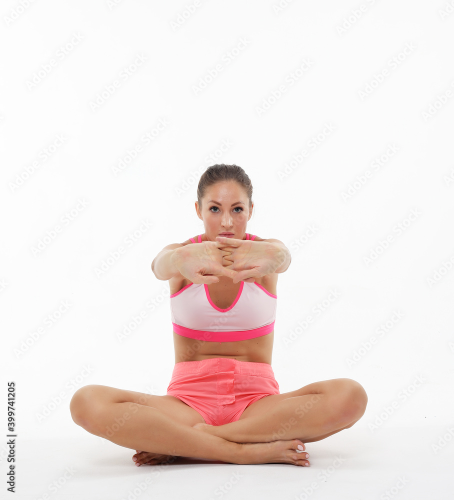 Yoga and sport concept - Beautiful young woman doing yoga, isolated on white background