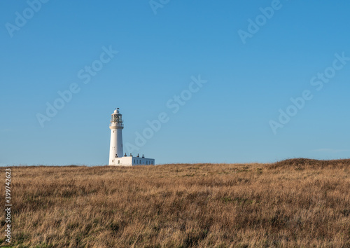 Distant view of white lighthouse © Alex