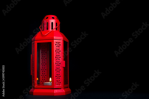 Wallpaper Mural Red Ornamental Arabic lantern with burning candle glowing on black background. Festive greeting card, invitation for Muslim holy month Ramadan Kareem. Christmas lantern with candle isolated Torontodigital.ca