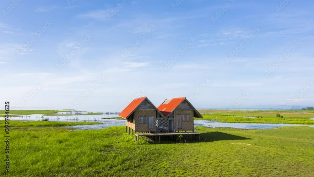 4K time-lapse of alone abandoned house the landmark of Thale noi wetland in Phatthalung province, Thailand 4K time-lapse of alone abandoned house the landmark of Thale noi wetland in Phatthalung province, Thailand