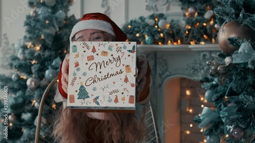 The girl holds out a gift. The girl gives a box with the inscription: 