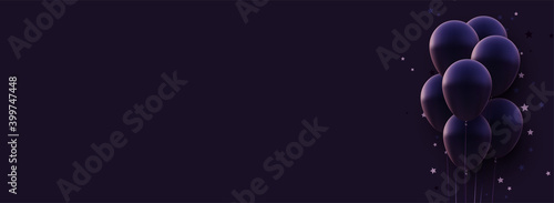 Bunch of matt dark violet balloons with threads on dark background.