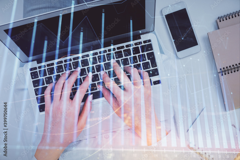 Double exposure of woman hands working on computer and forex chart hologram drawing. Top View. Financial analysis concept. Double exposure of woman hands working on computer and forex chart hologram drawing. Top View. Financial analysis concept.