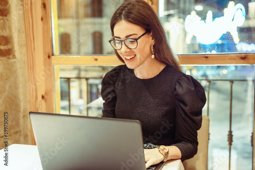 girl in a coffee shop with laptop