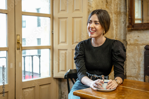 girl in a coffee shop smiling