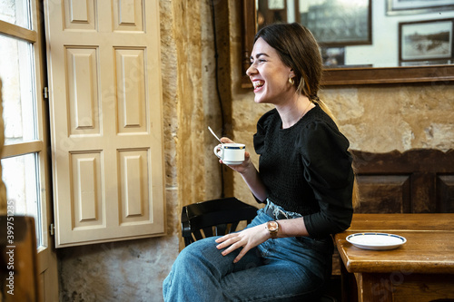 girl in a coffee shop smiling