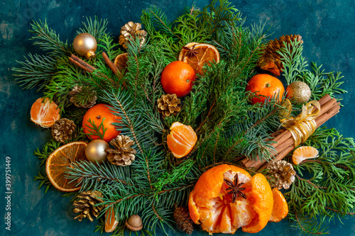  Christmas and New Year compositions on a on a green background, tangerines, oranges, gingerbread. Copy space, flat lay